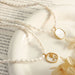 French Baroque Pearl & Shell Necklace – Oval Pendant with Zircon Inlay