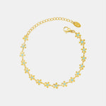 Golden Blue Drip Oil Charm Bracelet with Flower Accent Design