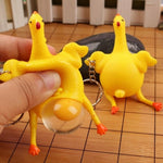 New Funny Spoof Tricky Gadgets Chicken Egg Laying Green Dinosaur Beans Toy Keychain